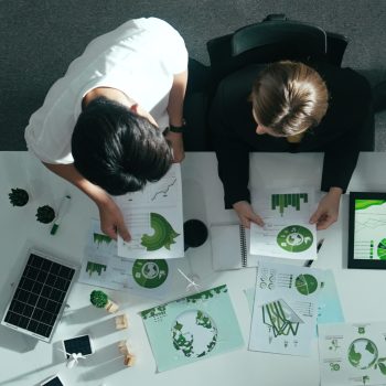 Top view of businessman and manager talking about clean energy. Alimentation.